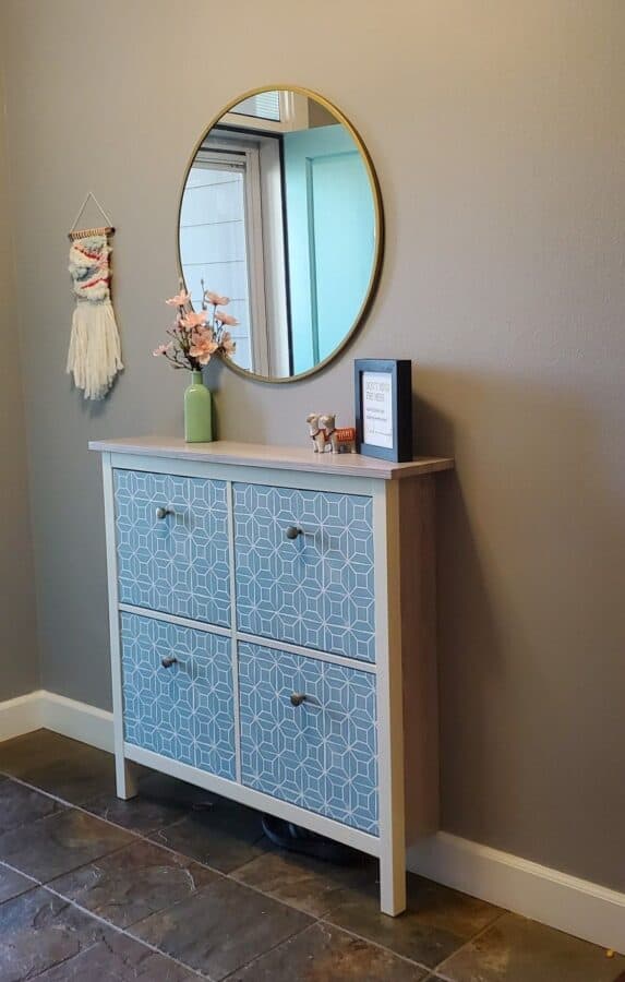 White IKEA Hemnes cabinet with blue patterned drawer fronts.