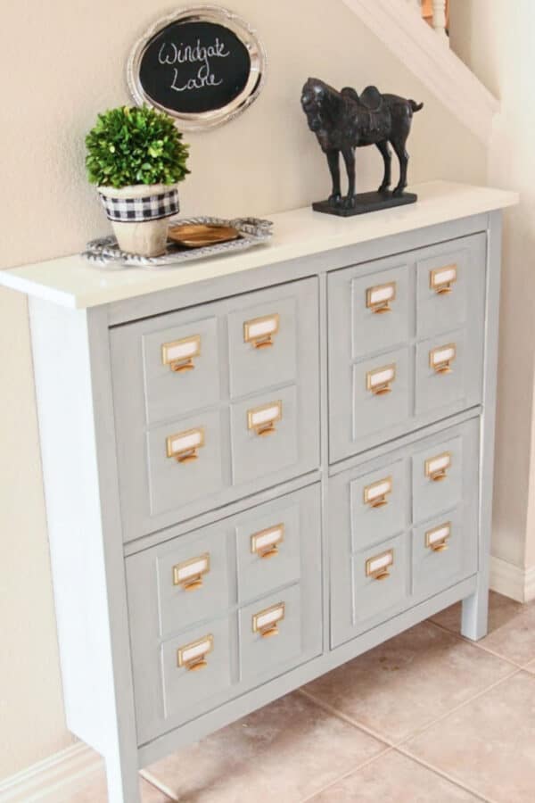 Grey painted IKEA Hemnes unit that looks like antique card catalog.