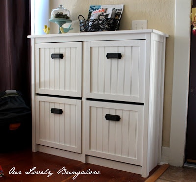 White IKEA Hemnes shoe storage unit with wood panelled drawer fronts.