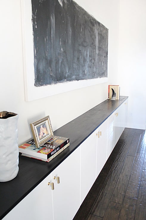 Floating white wall cabinets.