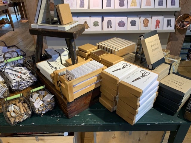 Display of haberdashery items inside Liberty's of London, including scissors, patterns, books and more.