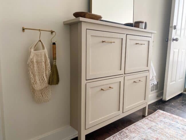 Beige painted IKEA Hemnes shoe storage unit.