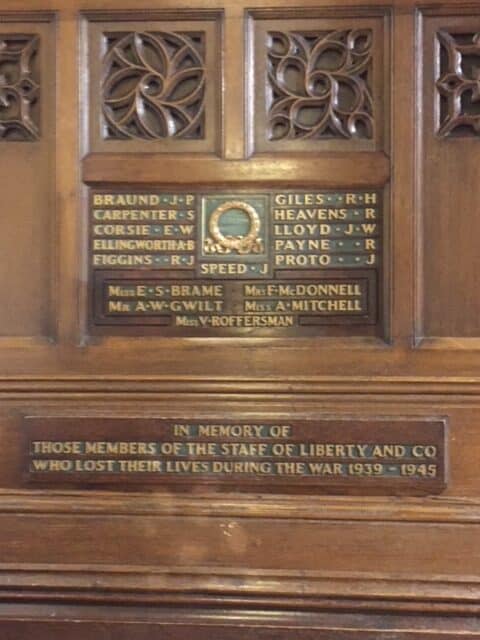 Wooden carved memorial to those who died in the Second World War in Liberty's of London.