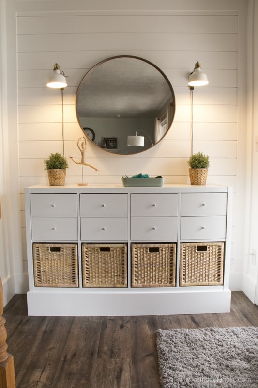 IKEA Kallax entryway storage unit with baskets.