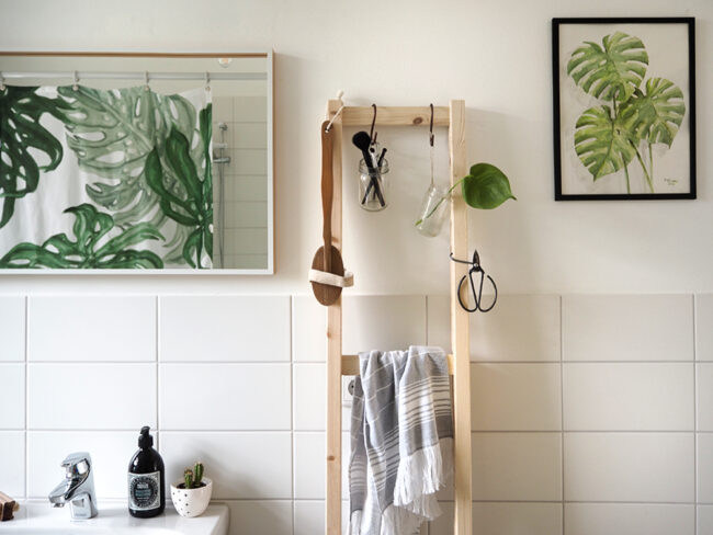 Wooden hanging storage unit in bathroom.