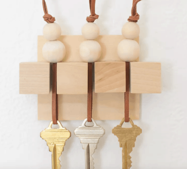 Wooden wall key holder.