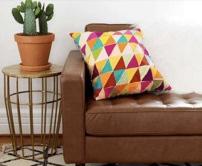 Multicolored geometric fabric felt pillows.