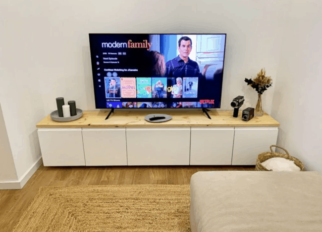 White media console with wooden top.