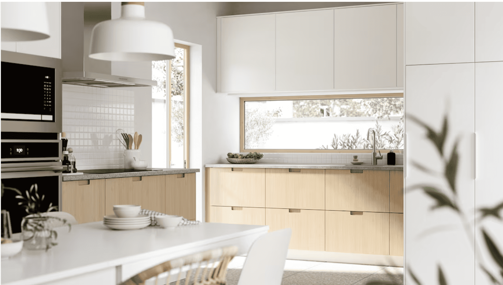 Kitchen with light wood cabinets.