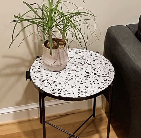 Terrazzo side table with plant.