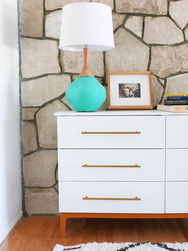 White and gold Mid Century modern dresser.