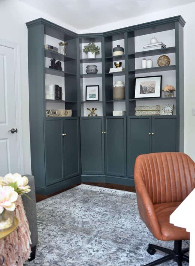 Black corner fitted bookshelves.