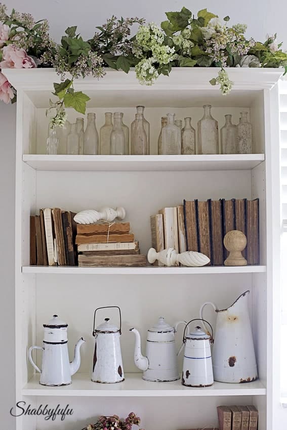 Decorative white wall shelving unit.