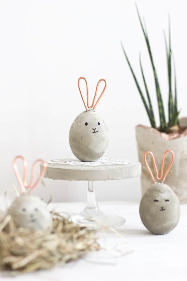 Concrete and copper eggs that look like Easter bunnies.