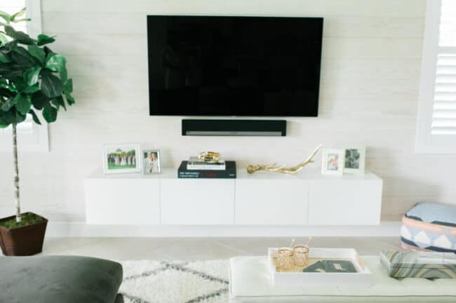 White floating media console.