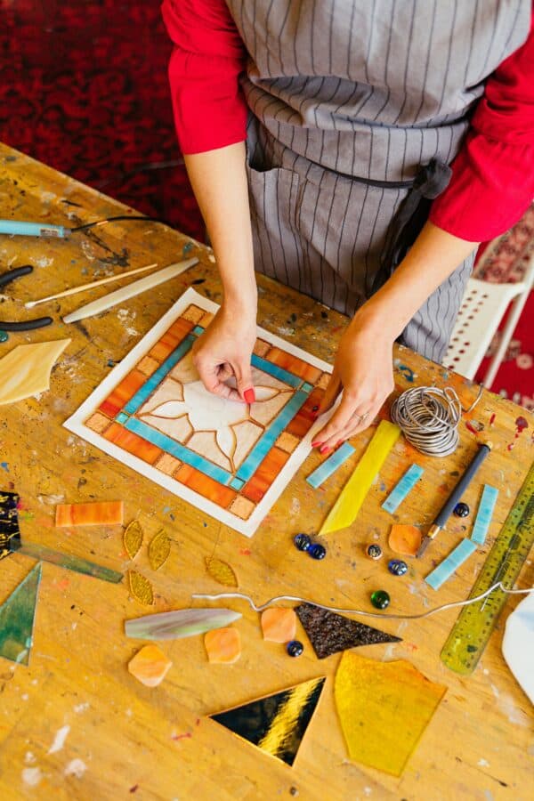 Woman making a stained glass window.