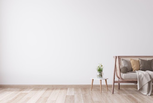 wooden floor with side table and sofa.